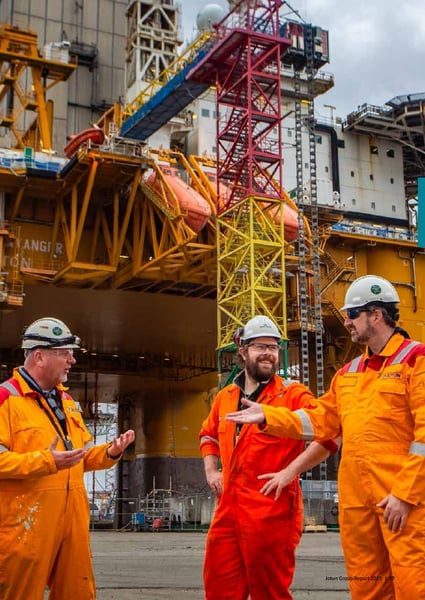 Jotun employees in safety gear at industrial site